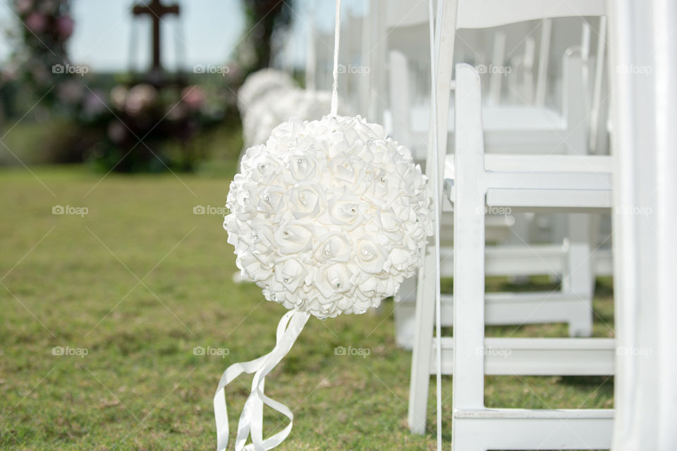 Wedding ceremony Isle Decor. white chairs and white flower balls