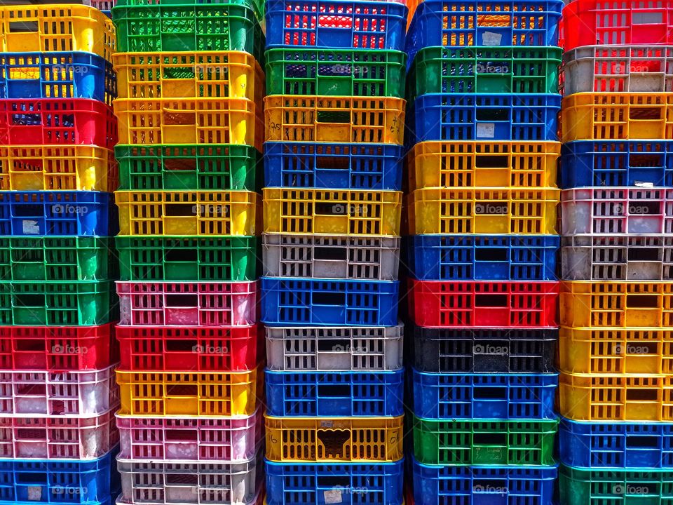 Arrangement of colorful plastic baskets for storage of various items.