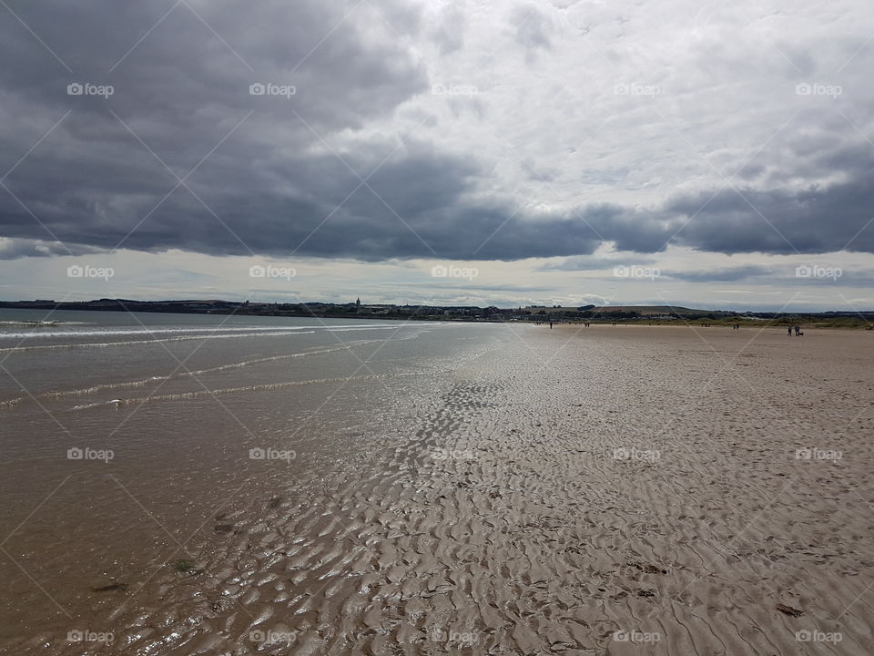 Beach in St Andrews Scotland on a cloudy day