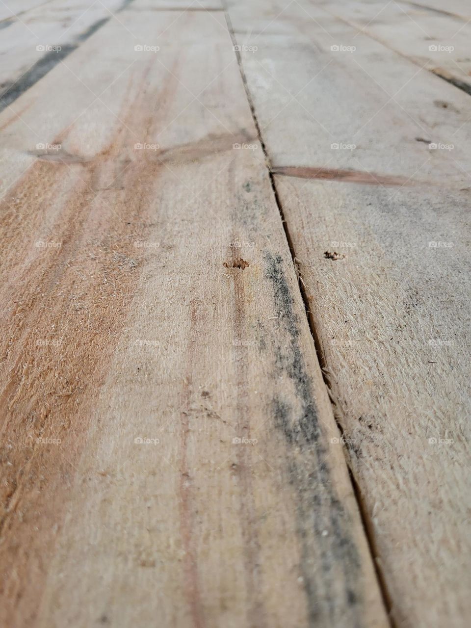 close up knotty pine planks sub floor barn repair