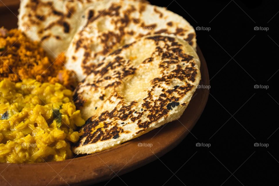 Fresh, home made coconut roti, a Sri Lankan type flat bread with creamy dhal curry and spicy coconut sambol.