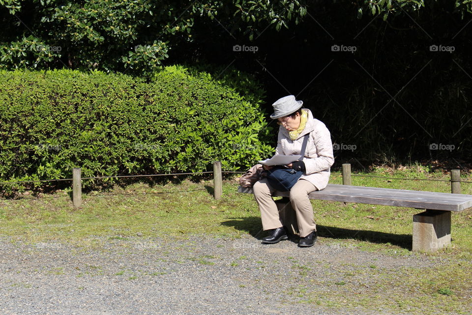 Older lady in Hama-Rikyu Gardens Tokyo Japan