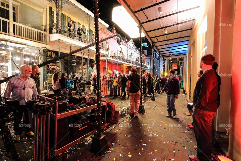 Camera operating of the commercial filmmaker behind the scene at night in French Quarter New Orleans Louisiana USA 