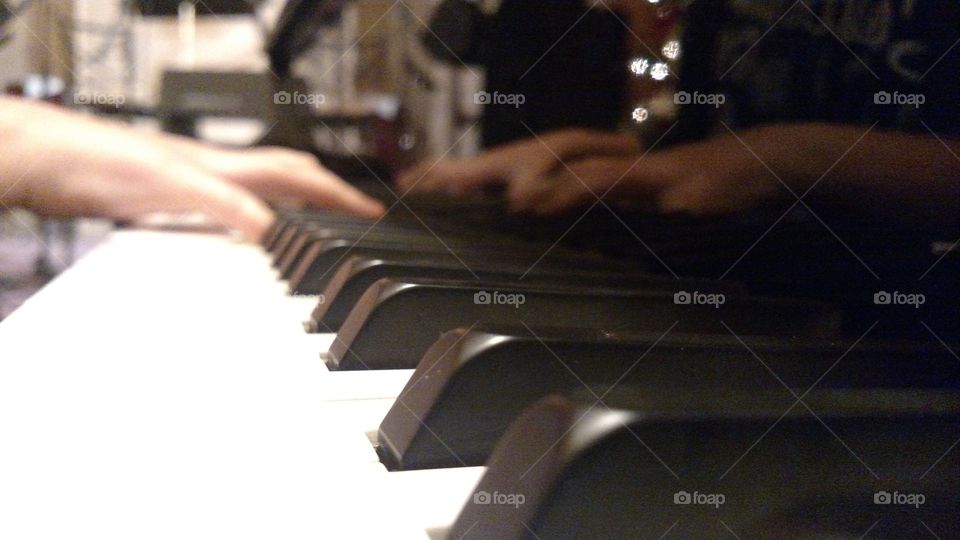 Close up of piano playing.