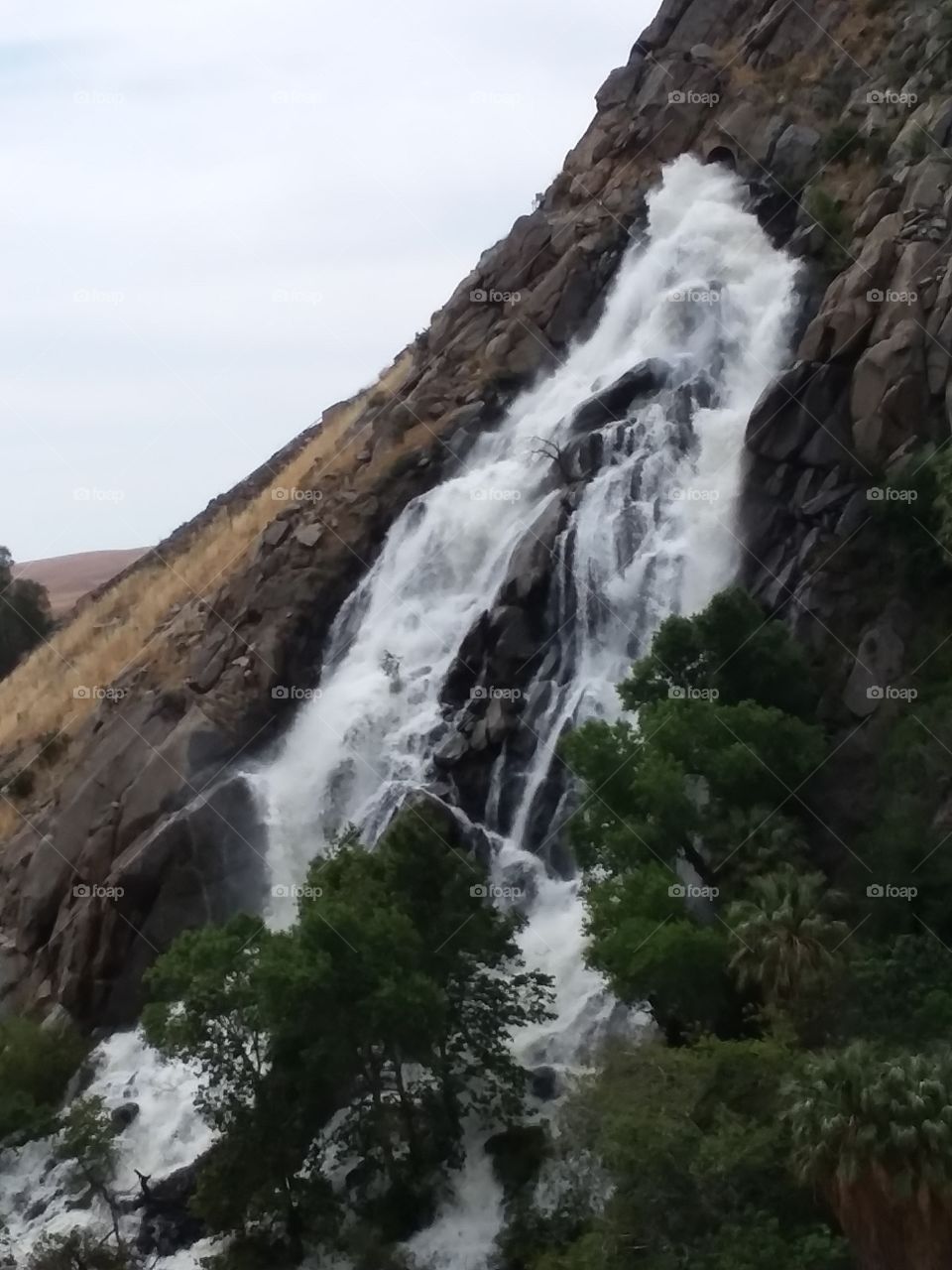 falling water from the side of a
 mountain