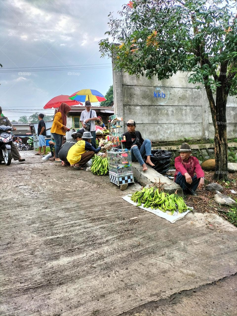 Vendors are selling on the side of the road