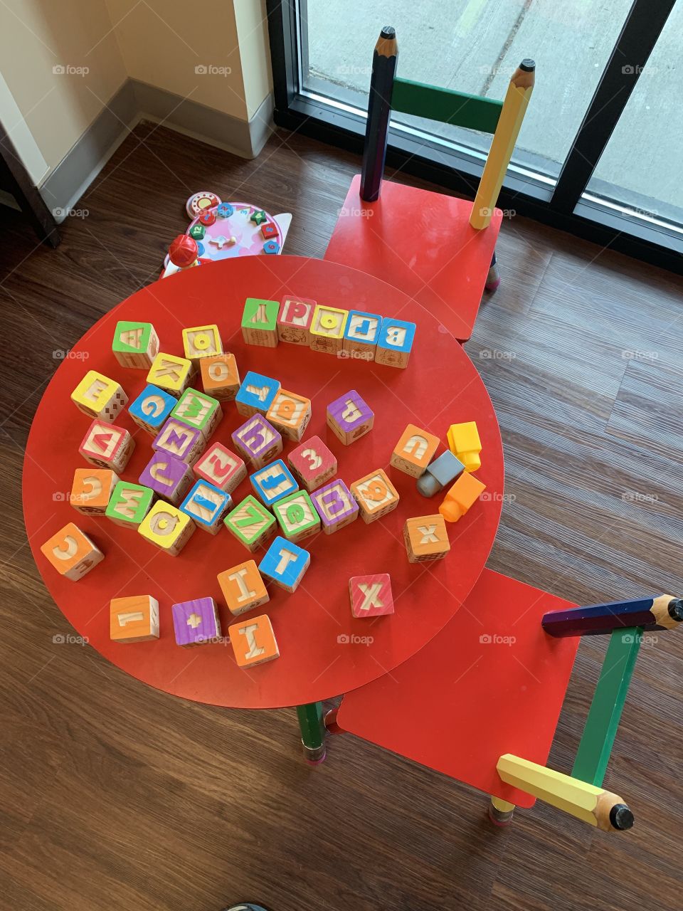 Child’s desk and chair with colorful Letter building blocks