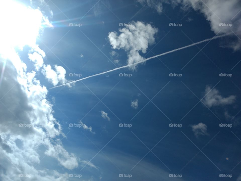 Bright Sun with Aeroplane Smoke