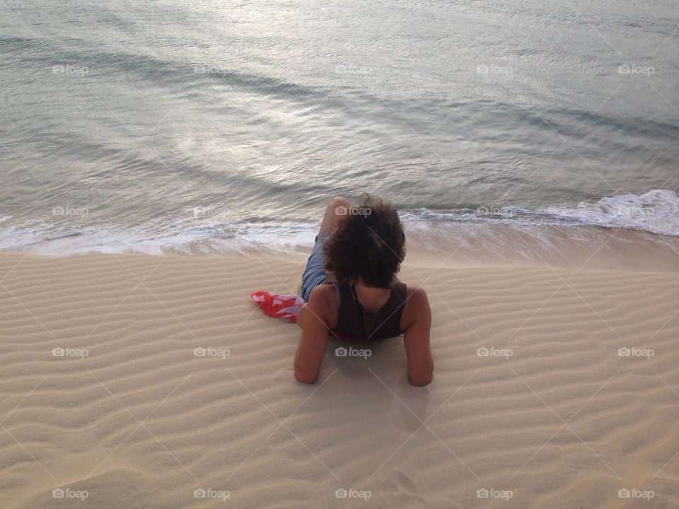 Woman looking at the sea 