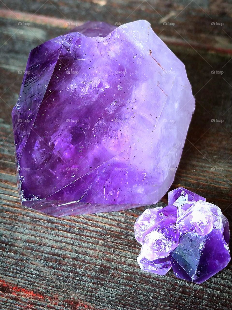 Purple cascade. Two pieces of the raw purple amethyst mineral. Semi-precious mineral - amethyst