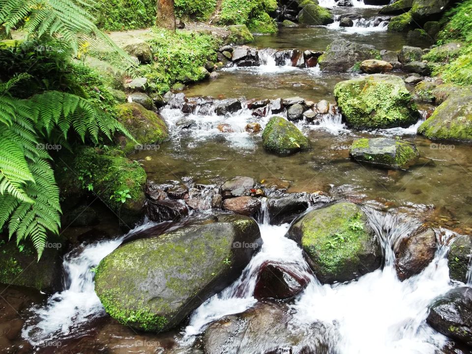 water flowing. water flowing under waterfall