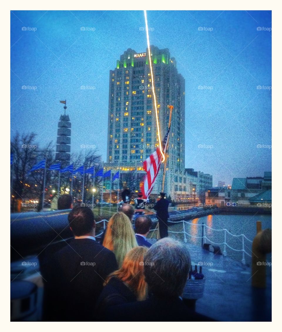 Lowering the colors on the USS Olympia