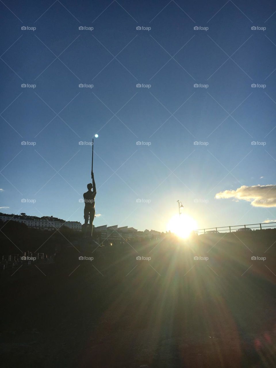 Beautiful image capturing Damien Hirst’s Verity statue in Ilfracombe, Devon. Shows sunset and moon on the tip of Verity’s sword. 