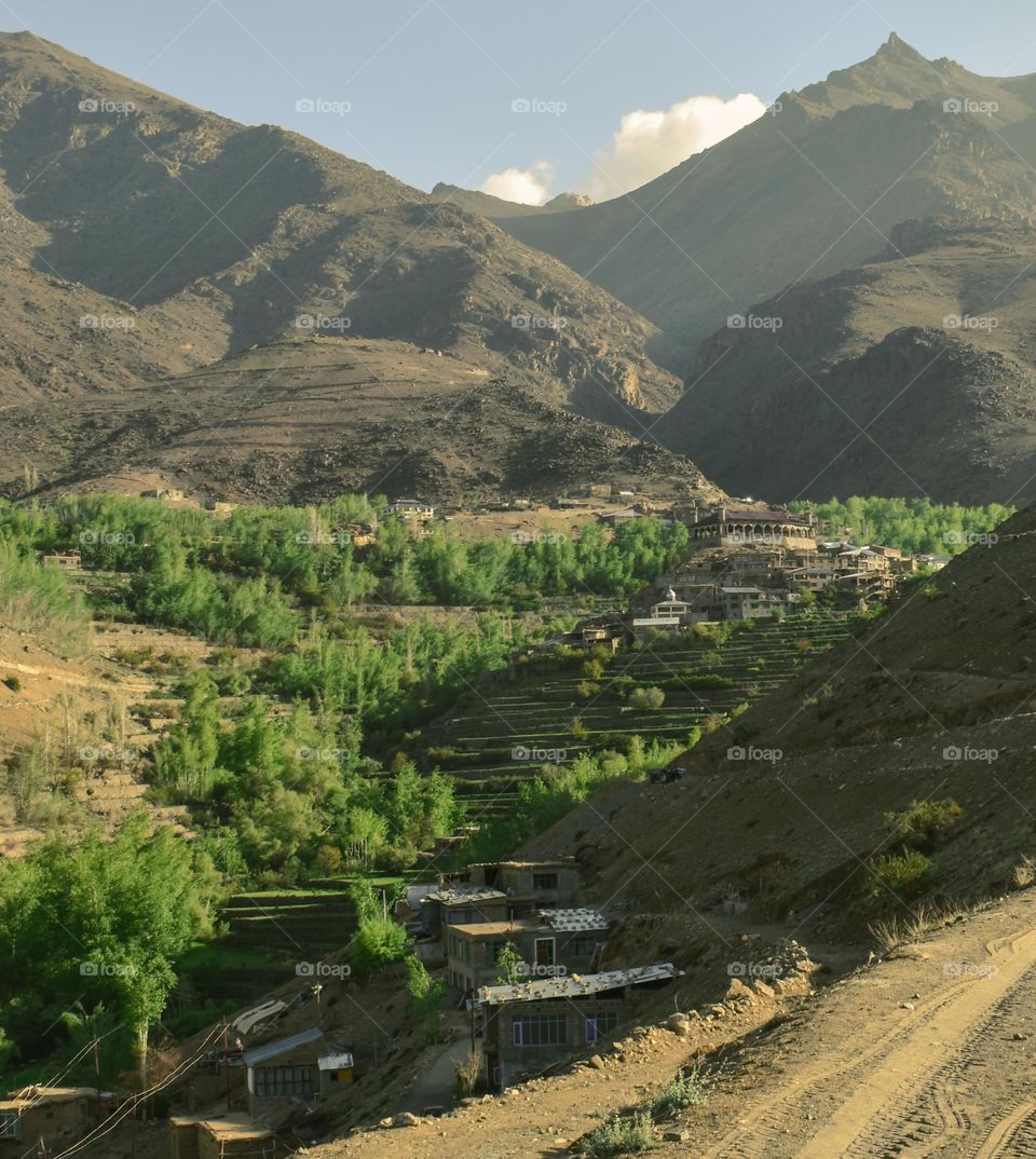 a rural village in the valley and mountain landscape
