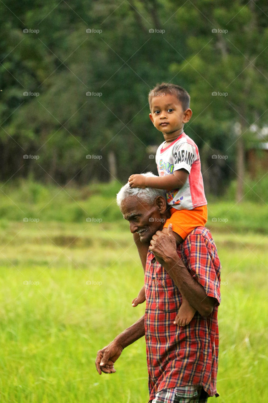 Close-up of grandfather with grandchild