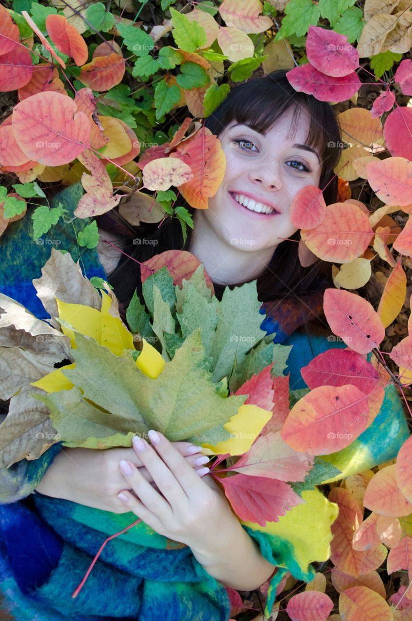 Happy Young Girl on Autumn Background