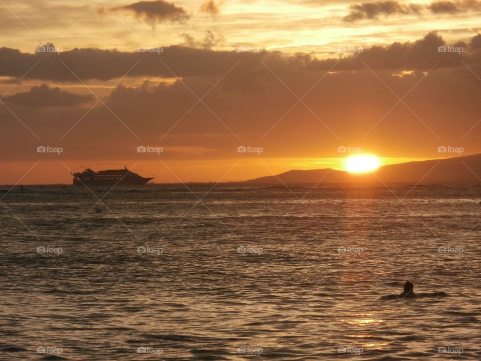 Sea and sunset. Sun setting over the sea