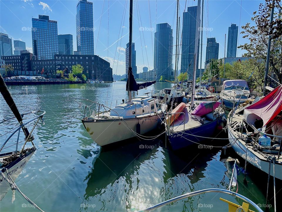 This is picturesque “Newtown Creek” by the “ Pulaski Bridge“ in LIC, Queens with its many boats seen from „Salvation“, a „28 ft 1969 Luhrs“ cabin cruiser that is home to myself and partner „Timothy Trespas“. 2024. Hypnotic Productions