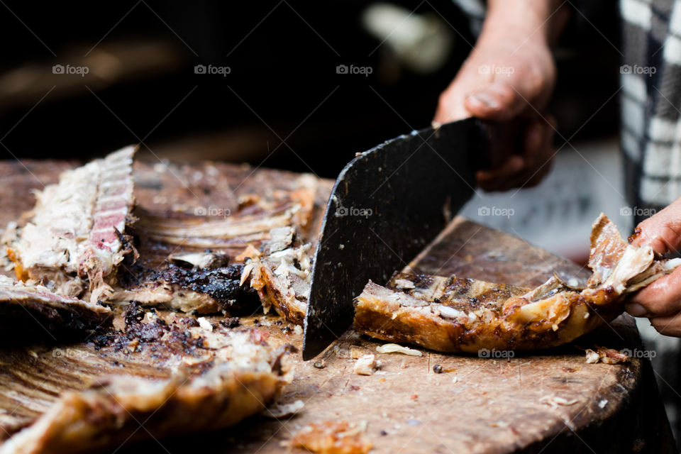 cutting roasted Lamb