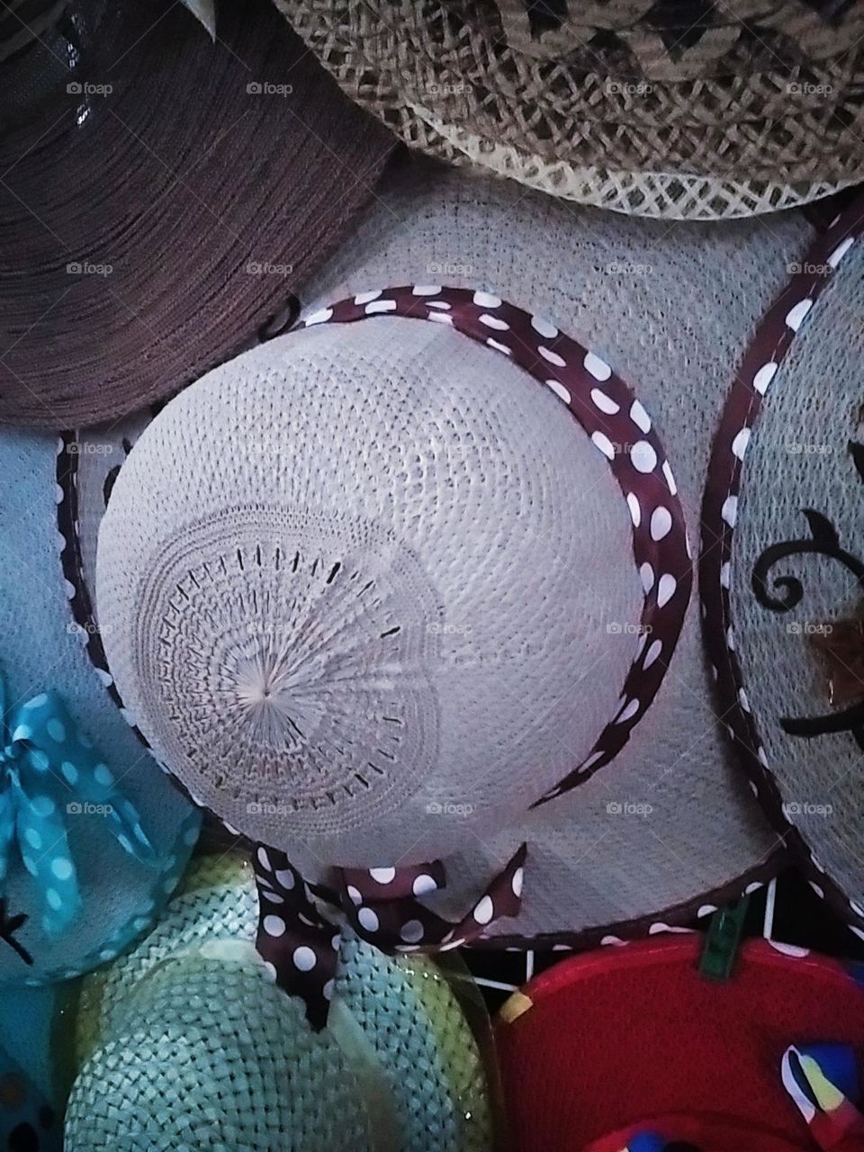 White wide hat with polkadot ribbon
