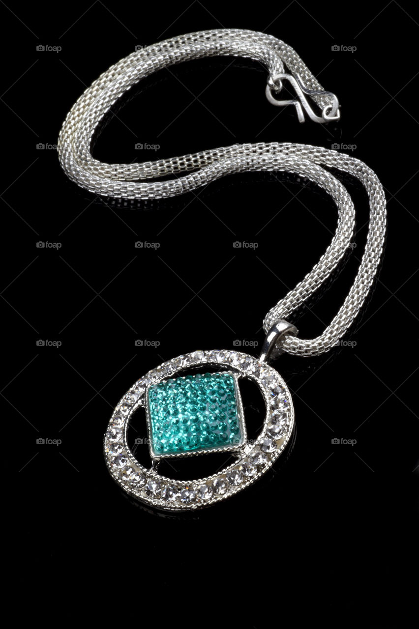 Beautiful turquoise jewelry necklace on black background