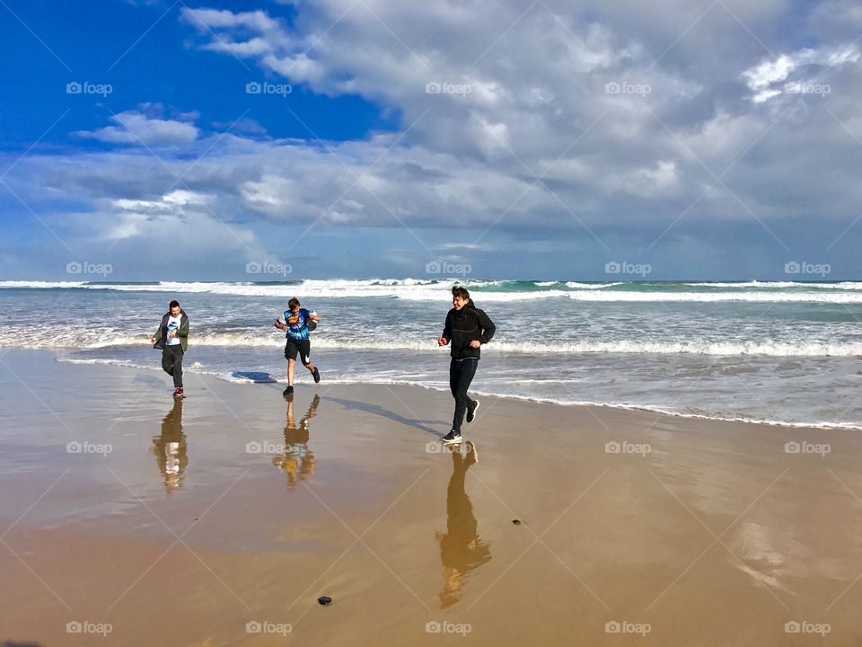 The boys having fun at the beach