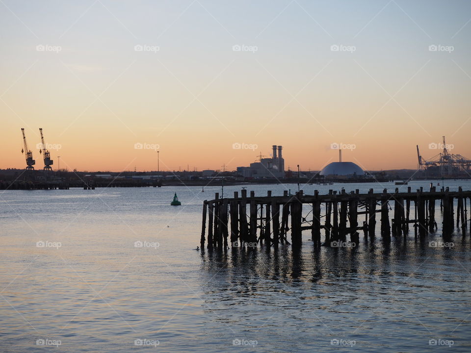 Pier and cranes at Southampton at sunset