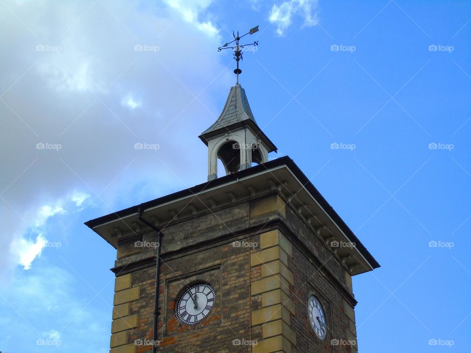 Tower of Holywells Stable, clock, wind indicator, England