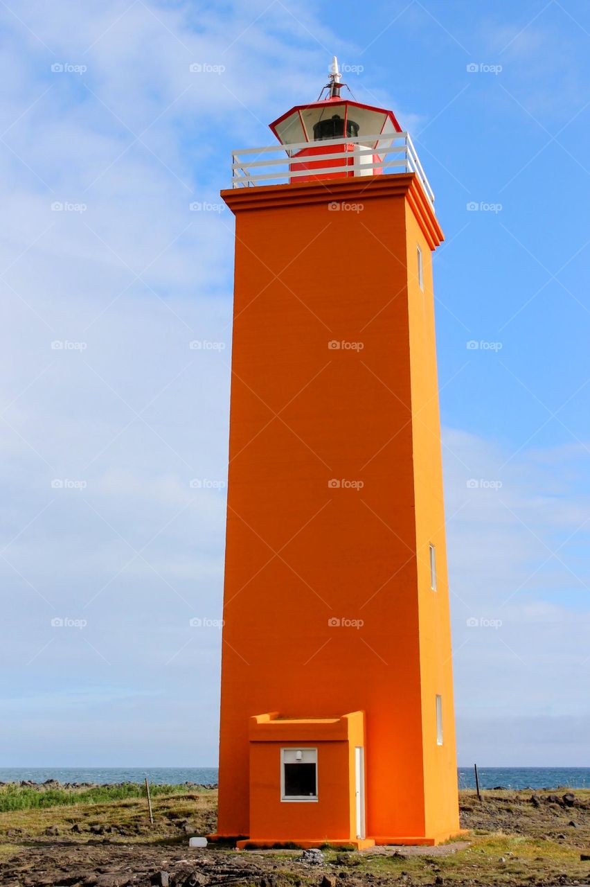Orange lighthouse in the sunshine
