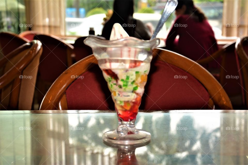 “Domino sweet” ice cream, fruits, jelly and milk 