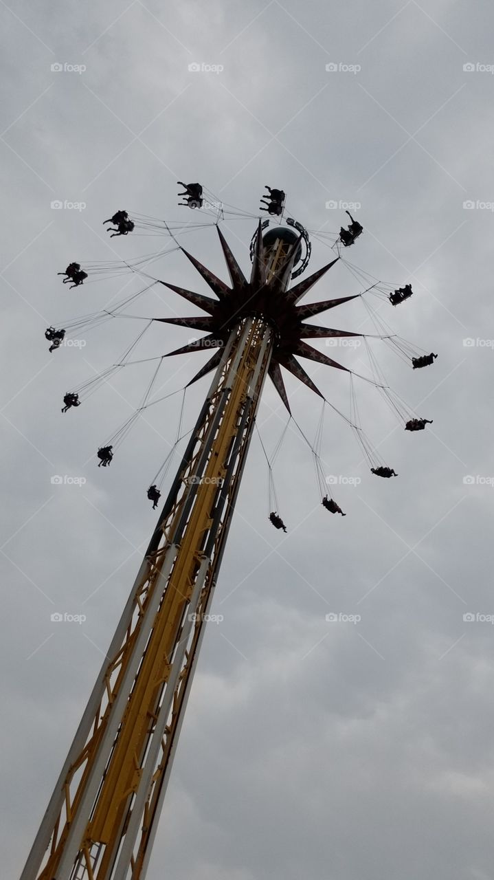 The big swing ride at Six Flags in Dallas against an overcast day.