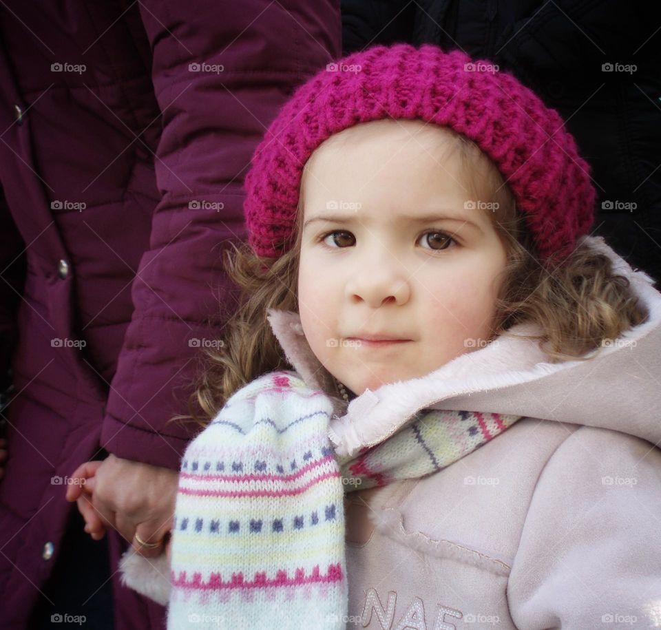 Little girl holding her grandmother's hand