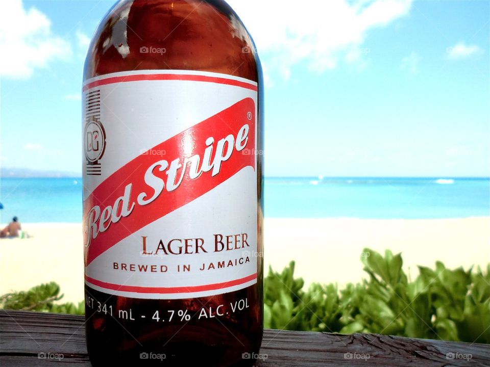 Taking a Red Stripe beer at Jamaica