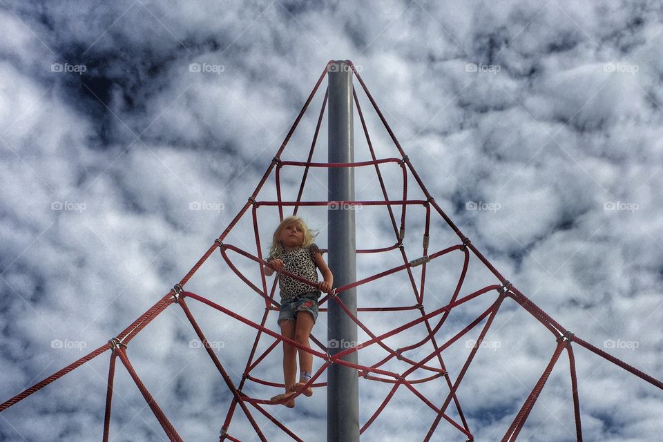 Girl on a climbing frame