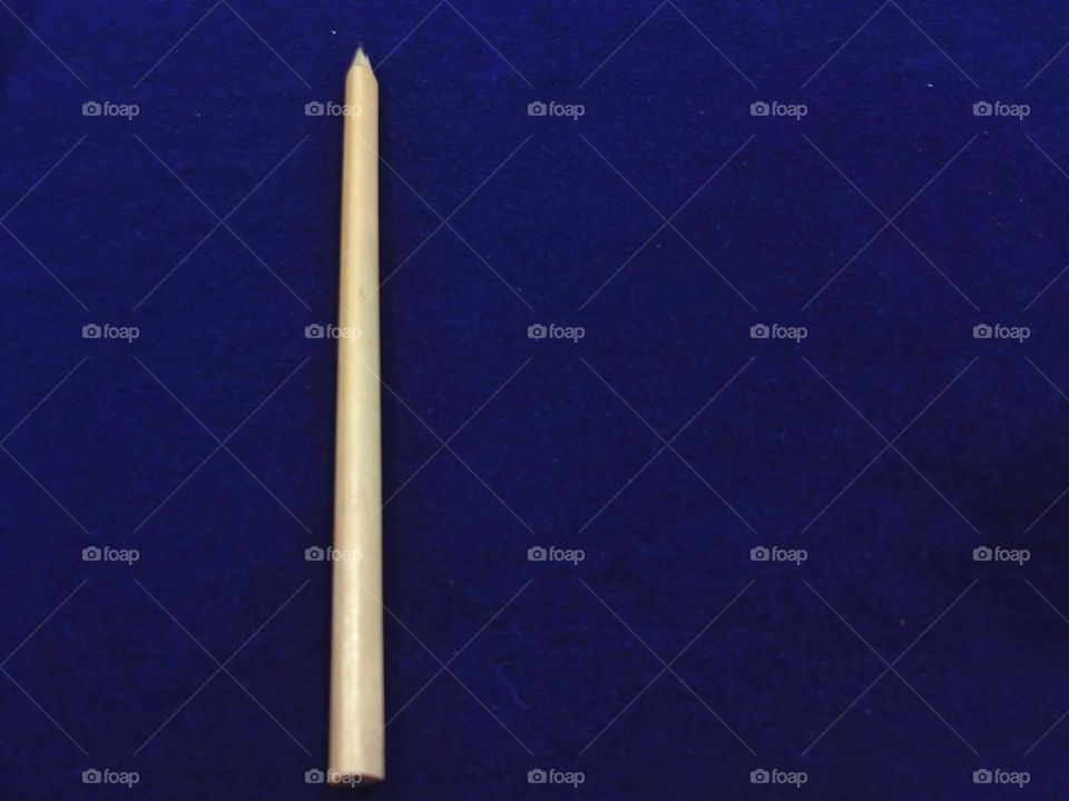 A pencil with blue background