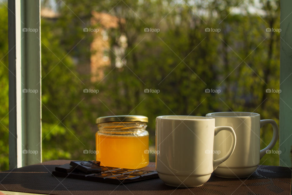 Breakfast on the balcony. Tea honey and chocolate.