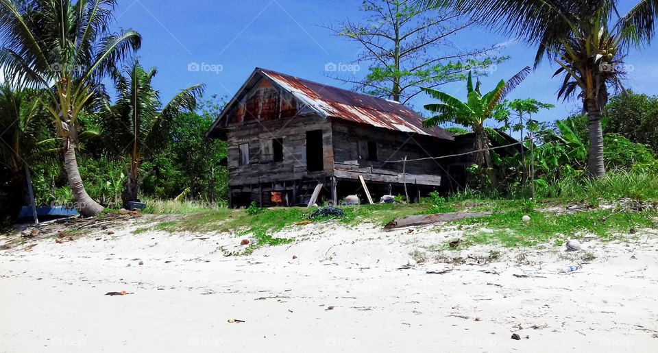 Traditional house by the beach on a small island.