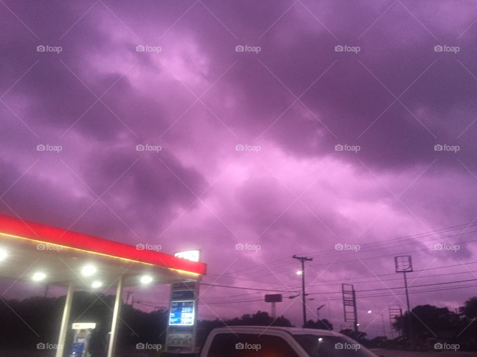 Caught an amazing picture of a stormy night where the clouds that actually made the sky turn purple