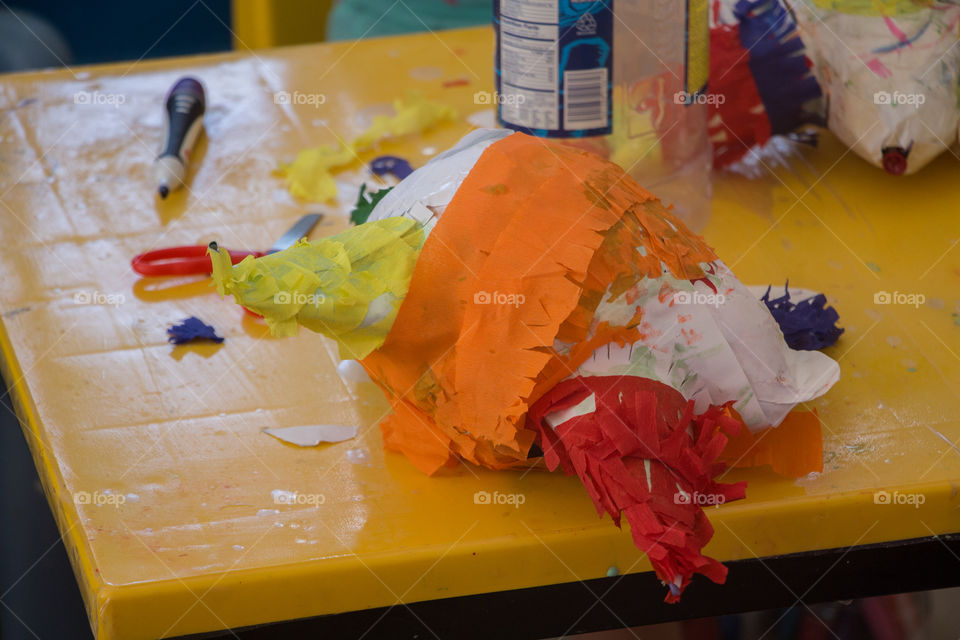 making a piñata with recycled paper