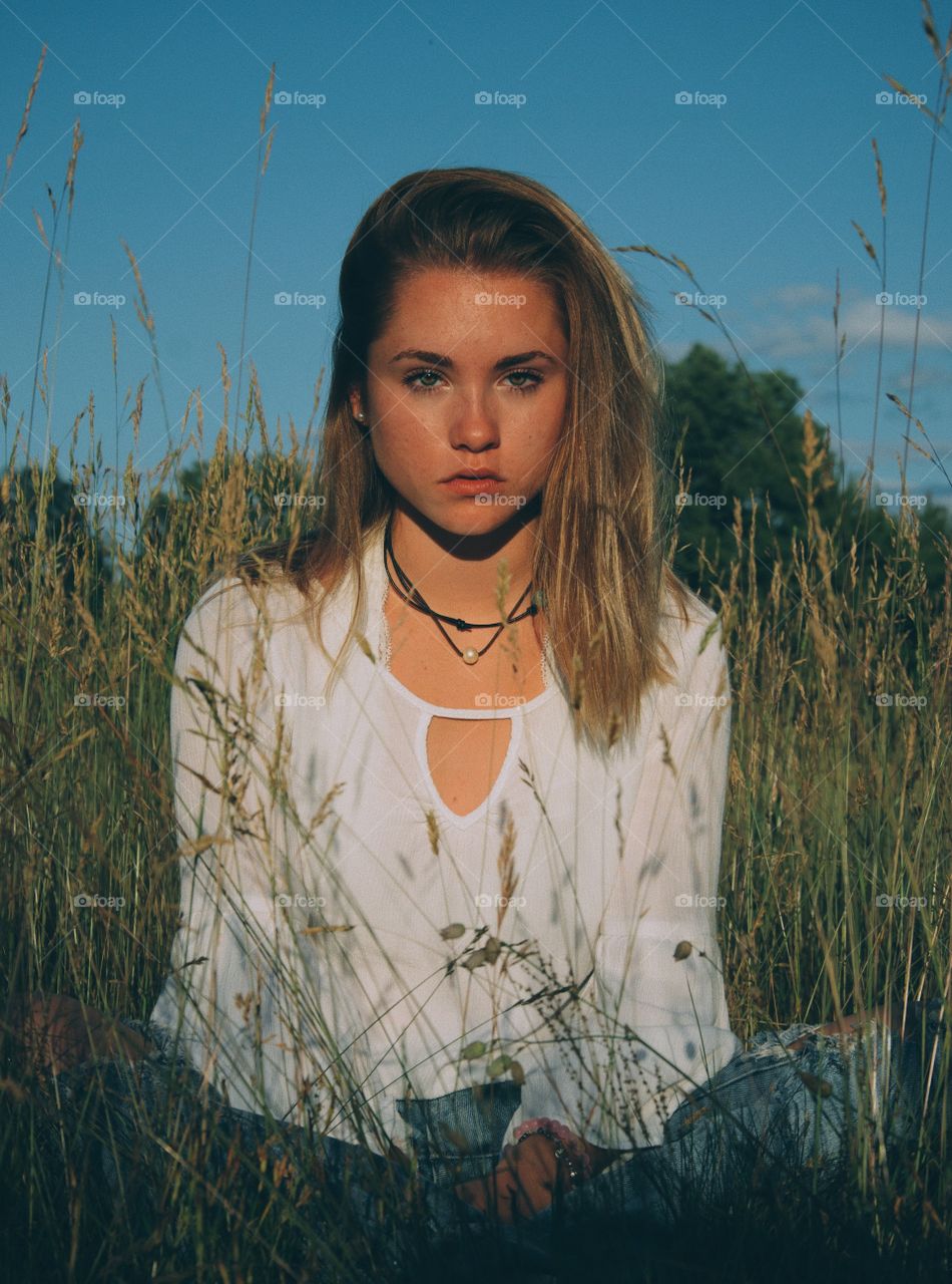 girl posing in grass