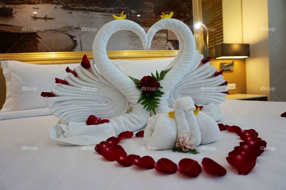 Honeymoon towel set up with rose petals