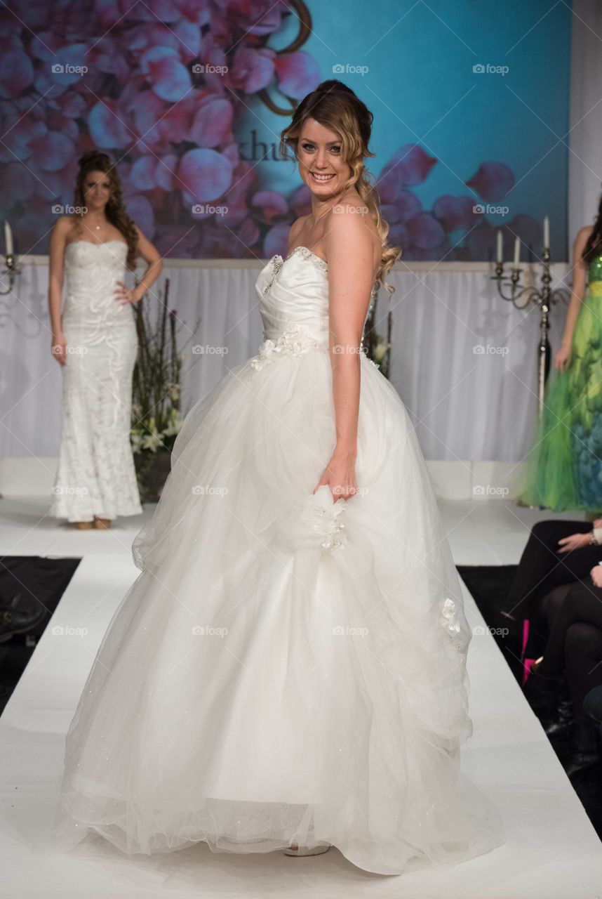 Fashion show at a wedding fair. Here are the latest dresses and clothes for both bride and groom.