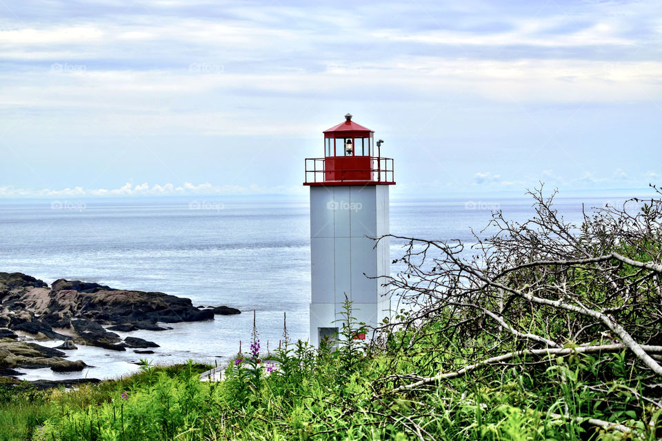 An ocean view with the lighthouse in New Brunswick Canada on a summer vacation up north 