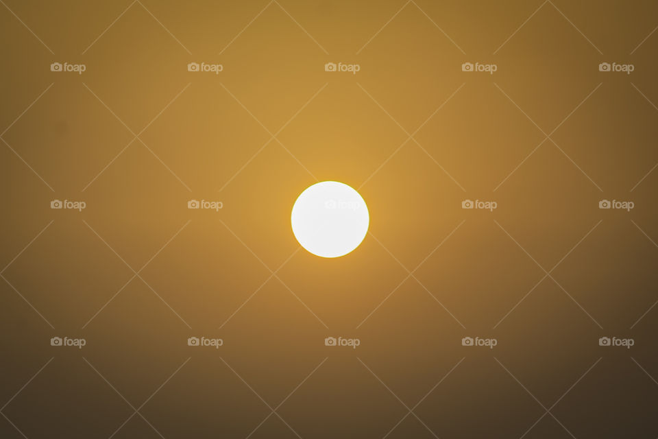 Fantastic yellow red sky and sun. apocalyptic sky. background. Abstract orange sky. Christmas festive gold background. Soft Focus.