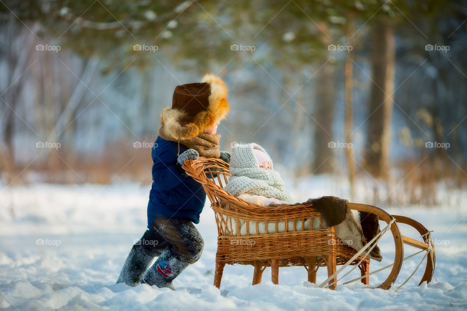 Children playing  at cold winter day