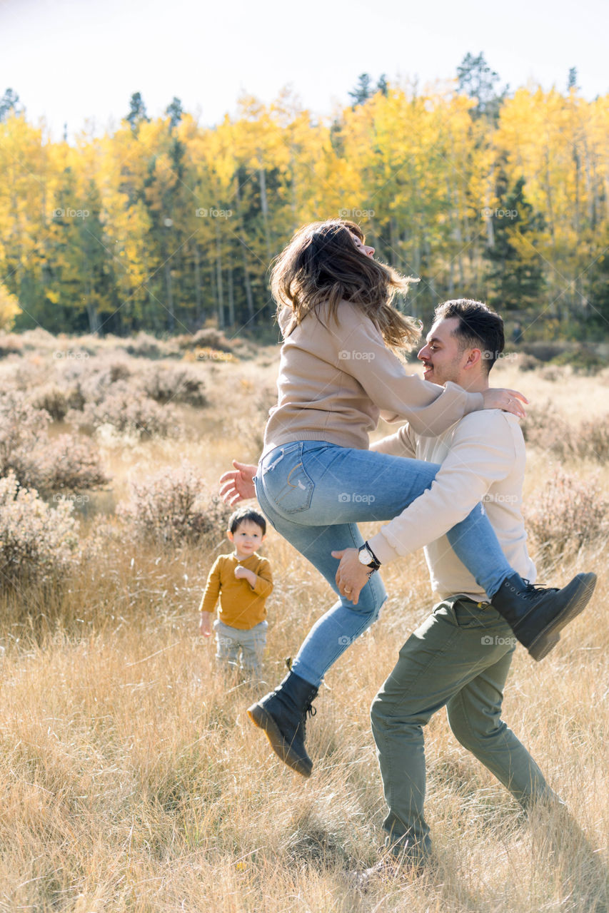 Playful couple on a hike during fall 