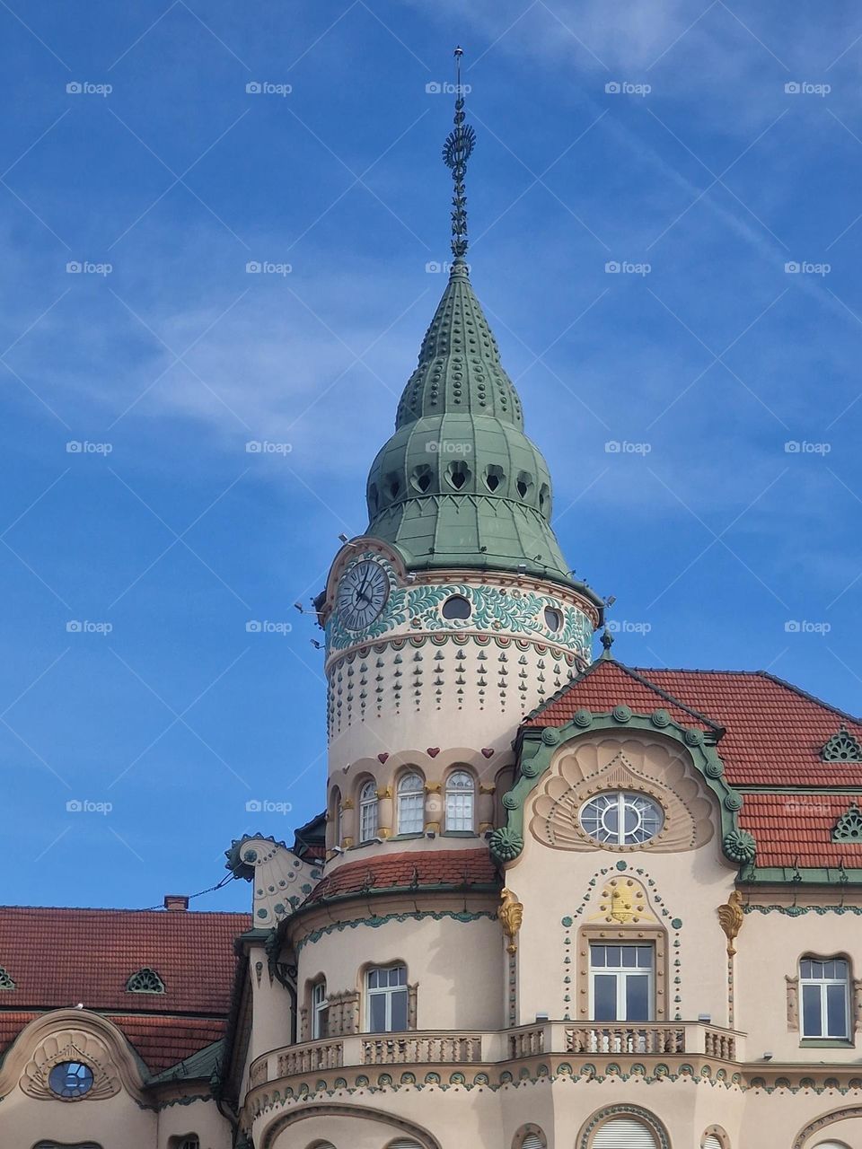 the clock tower of the black eagle palace in Oradea