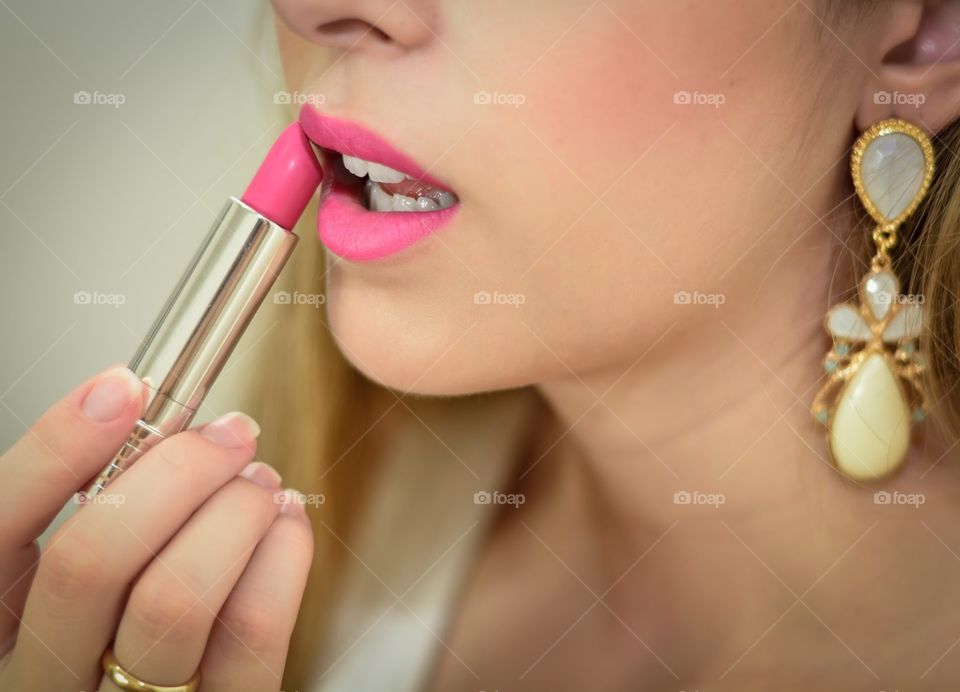 Woman Passing Lipstick