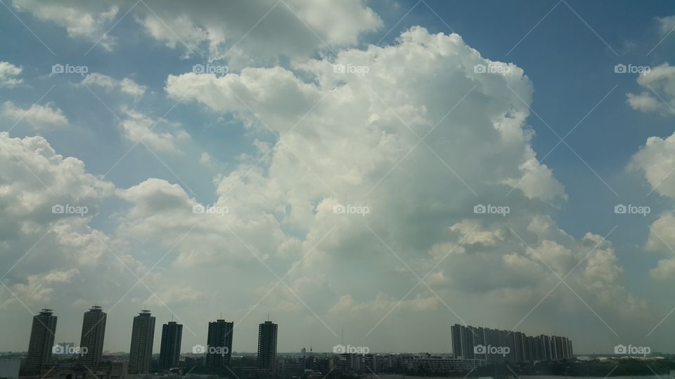 skyscrapers buildings silhouette on a cloudy skyline