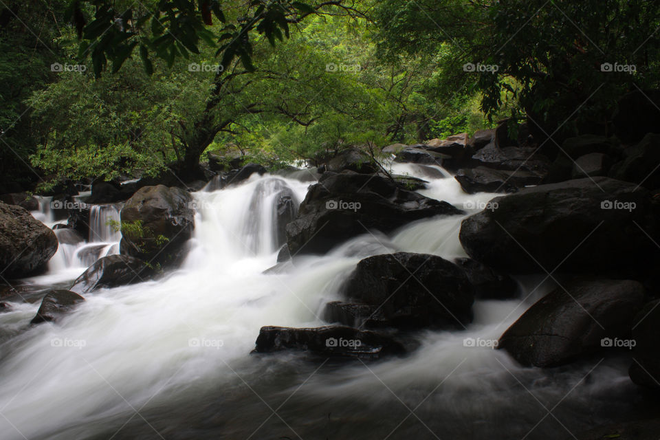 Water steam flowing across the rocks